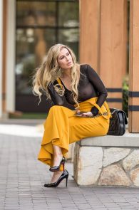 Ana Braga Wearing A Sheer Top And Yellow Jumpsuit